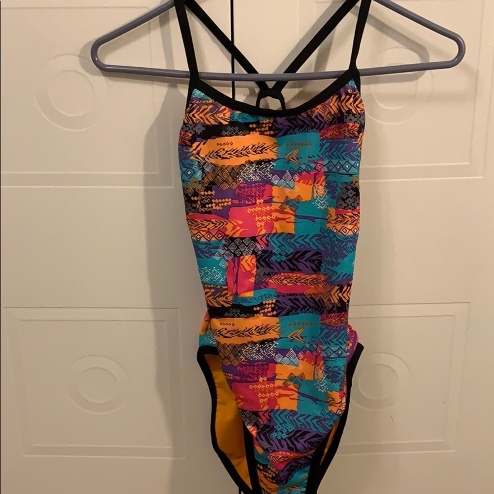 One piece swimsuit with open back.